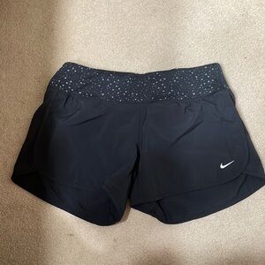 Black Nike running shorts